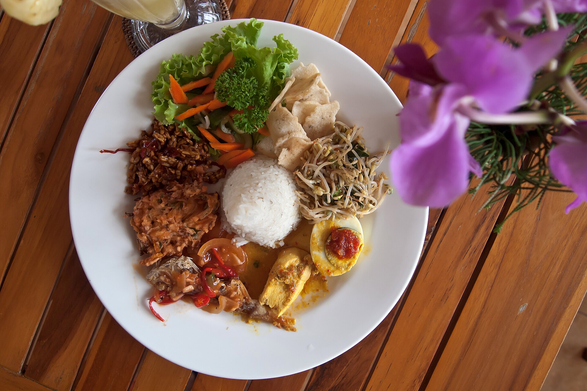 Indonesian street food feast with rice, sambal and sides